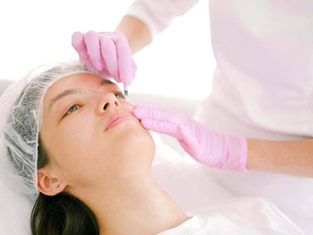 A Botox injection being applied by a facial aesthetics professional